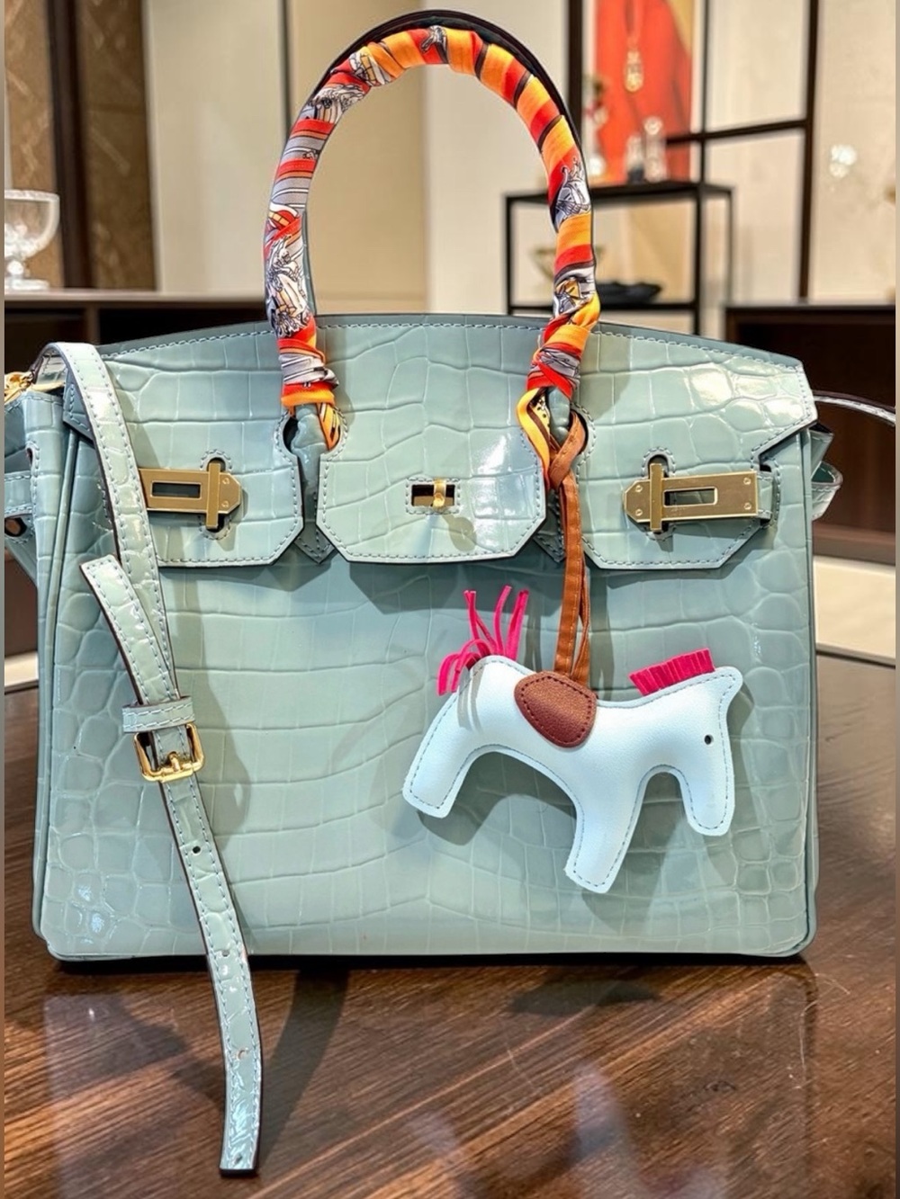 Light turquoise faux leather croc bag with scarf wrap and horse charm